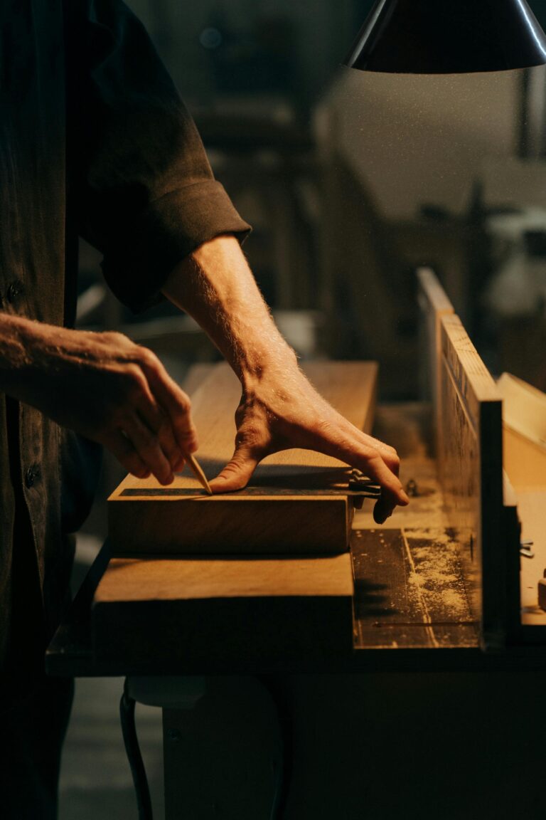 A carpenter working on a wood-framed home